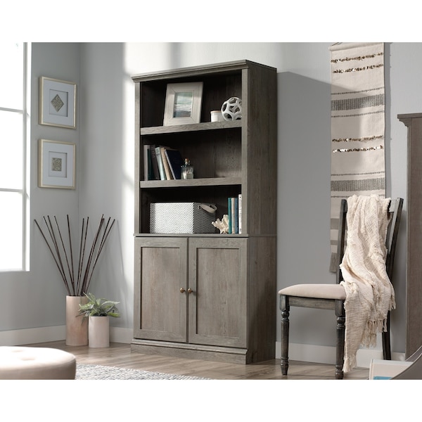 5 Shelf Bookcase W/doors Myo , Three adjustable shelves for flexible storage options